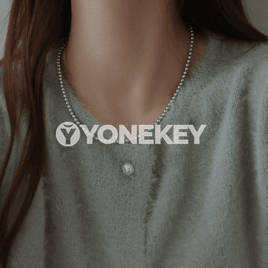 Zenanlar üçin owadan görnüşli merjen monjukly zynjyr.